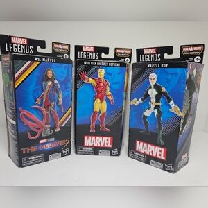 3 Marvel Legends Action Figures - Red, Blue, Yellow, White and black.